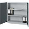 Gray steel cabinet, open doors, inside three compartments with binders and notepad.