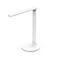 Witte LED bureaulamp met ronde voet en verstelbare arm, zwarte en witte achtergrond.