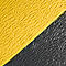Yellow and black textures meet diagonally. Ridged surface reminiscent of leather.