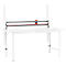 Gray cutting device over a white table. Red accent. White shelves behind the table.