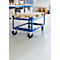 A blue transport cart with a pallet in a warehouse. The cart has four wheels.