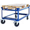 Blue cart with pallet support, loaded with a wooden pallet. The cart has four wheels.