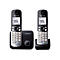 Zwei silber-schwarze Panasonic DECT-Schnurlostelefone mit Ladestationen vor weißem Hintergrund.