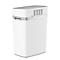 White paper shredder with gray accents and ventilation slots. There's an input slot on the top.