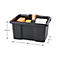 Boîte de rangement noire contenant des outils et des fournitures. Dimensions : 38 x 29 x 19,5 cm.