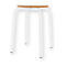 White stool with wooden top. Four-legged stool with round legs and a round wooden top.