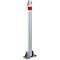 Gray standing bollard with red band and key. Attached to a concrete base.