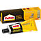 Yellow Pattex adhesive tube with black cap, behind it the product packaging with lettering and a picture of a chair.