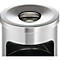 Close-up of a silver trash can with a circular opening and a rectangular opening on the side.