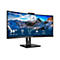 Ein schwarzer Philips Monitor mit 34 Zoll, der vor weißem Hintergrund steht und ein Bergpanorama zeigt.