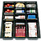 Black drawer with office supplies, including pencils, tape, paper clips, sticky notes, and correction fluid.