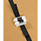 Black plastic strap with white clasp on brown background.