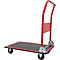 Roter Transportwagen mit schwarzer Ladefläche und Griff. Vorderrad drehbar gelagert. Auf weißem Hintergrund.