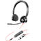 Black headset with microphone and red cable, next to it a control element with USB connection.