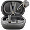 Dark grey earbuds with charging case. One earbud is in the case, one is being taken out. There is a USB connector in the case.