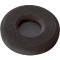 Dark gray headphone earcup. Round shape, a mesh inside. Rough, porous surface.