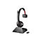 Schwarzes Poly Headset auf einer Ladestation mit beiliegendem USB-Dongle vor weißem Hintergrund.