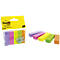 Sticky notes in different colors. Packaged on the left, individual pads on the right.