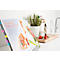 Marqueurs Post-it de différentes couleurs dans des contenants en plastique noir. "Post-it" est écrit sur chaque contenant.