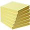 A stack of yellow sticky notes. The blocks are stacked on top of each other and slightly offset.
