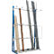 A blue metal rack with stored wood and plastic pipes.