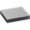 A stack of gray sheets, presumably paper or film, lying on a light surface.