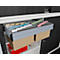 Open file cabinet with colored index cards, beige and red folders in the lower part. Gray cabinet doors.