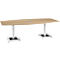 An oval wooden table with two metal legs.