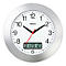 A round silver wall clock with a black dial and digital display. The hands are black, the second hand red.
