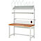 Werkbank met wit metalen frame, houten blad en bovenplanken. Opzetstuk is uitgerust met papierrollen.