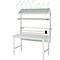 Établi blanc avec étagères et supports, contenant outils et matériaux.
