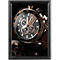 Close-up of a luxury wristwatch with a black dial, gold accents, and a leather strap.