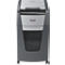Gray paper shredder. Rexel logo. Inscription: Automatic. Paper in collection container.