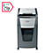 Grey paper shredder with waste bin. 'Rexel' logo. In red box: paper clip, glasses, credit card.