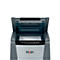 Paper shredder with open lid and paper inserted. Rexel's logo is visible.