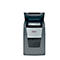 Grey paper shredder with open lid. The paper is in the chute. The "Rexel" logo is visible.