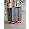 Grey transport box on red castors. Shelves with boxes in the background.