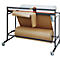 Paper cutting table with brown paper roll below and white paper roll above. The table has wheels for mobility.