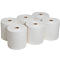 Seis rollos de papel blanco. Cilíndricos, de pie con un núcleo marrón.
