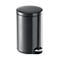 Dark gray pedal bin with round lid and foot pedal. Smooth surface, suitable for bathroom or kitchen.