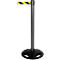 Black barrier post with yellow and black striped tape. On a round foot, tape extended.