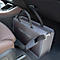 Sac de transport gris pour animaux de compagnie dans la voiture, avec bandoulière et fermeture éclair.