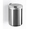 Gray, cylindrical wall-mounted waste bin with lid. Top with hole for trash. Mounted on white wall.