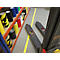 A forklift and shelves with colored adhesive tapes, yellow line on the floor.