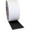 A roll of white adhesive tape with a black, rough surface. A piece of tape is unrolled.
