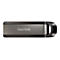 Clé USB SanDisk grise et noire. Le logo SanDisk est présent sur la clé USB.