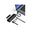 Ein schwarzes USB-C-Dock mit ZubehÃ¶r: SSD, USB-Sticks, und Kabel, die mit einem Laptop verbunden sind.