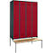 Red locker with four doors, gray frame and bench.