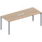 A light brown conference table with silver legs. In the center is a rectangular silver recess.
