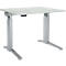 A height-adjustable desk, light grey tabletop, grey legs.